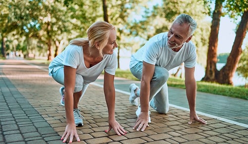 Fit middle aged couple preparing to job