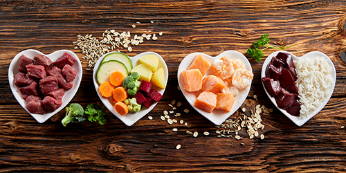 Healthy food in heart shaped dishes