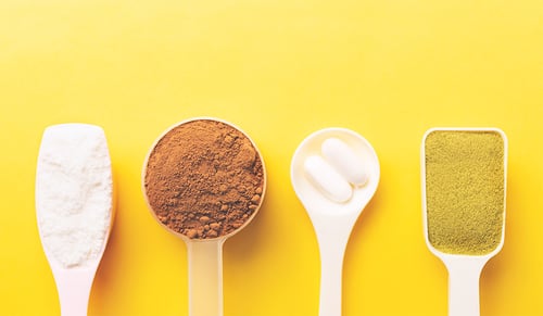 Various collagen powder types on yellow background- plain, matcha, chocolate, pills