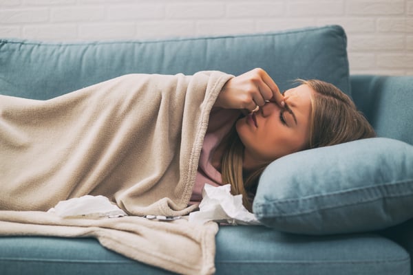 Woman having pain in sinus and fever